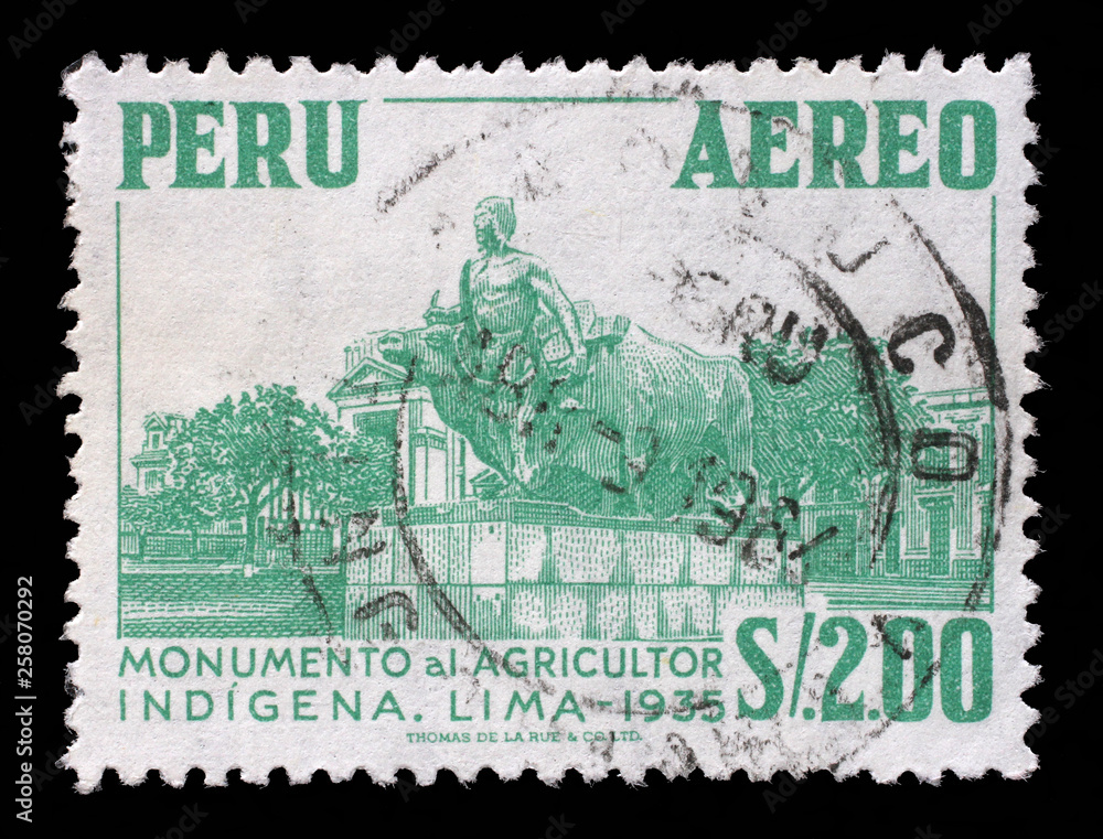 Stamp printed in Peru shows Monument to the indigenous farmer at Lima, circa 1962.