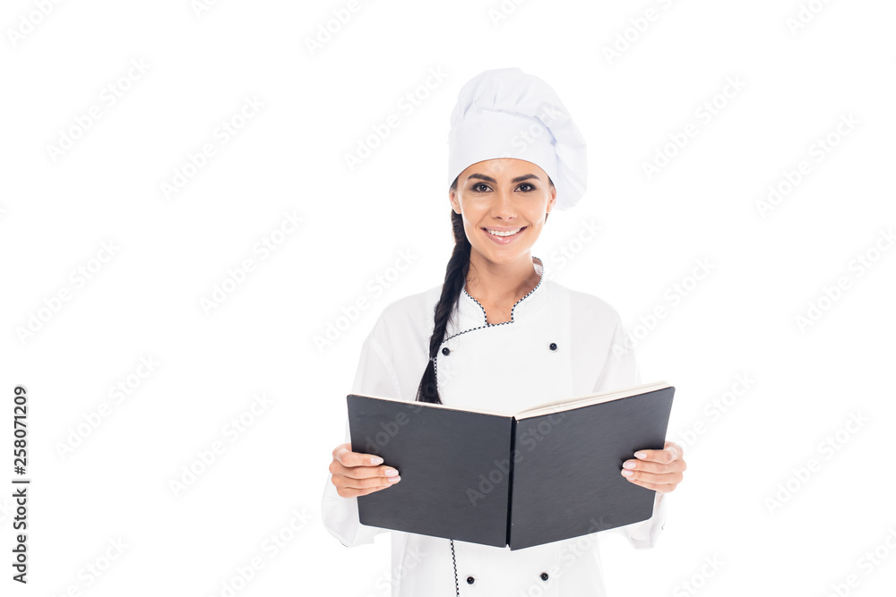 Chef in uniform holding black book isolated on white Chef in uniform holding black book isolated on white