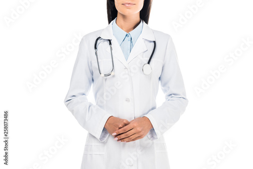 Partial view of doctor in white coat with stethoscope isolated on white