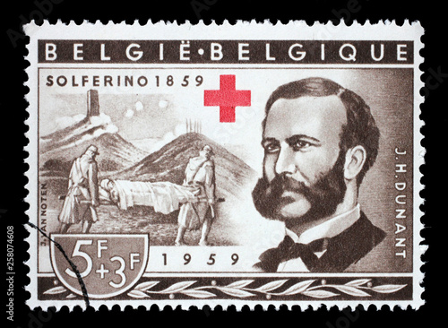 Stamp printed in Belgium shows Henri Dunant, Founder of the Red Cross and Battle of Solferino, Red Cross series, circa 1959. photo