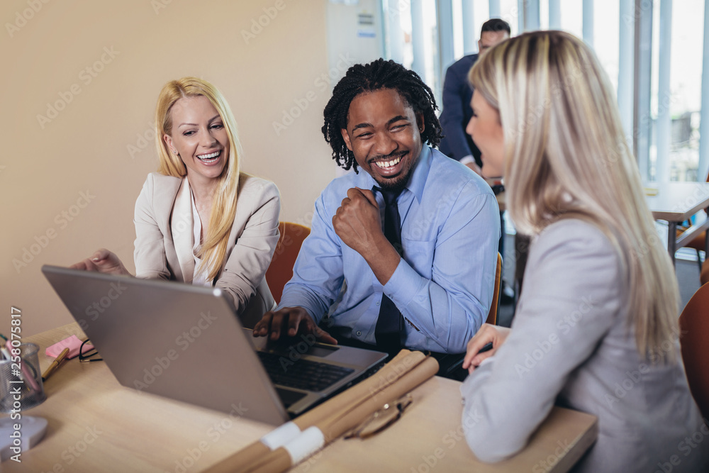 Group of young business people working together in creative office. Selective focus. Group of young business people working together in creative office. Selective focus.