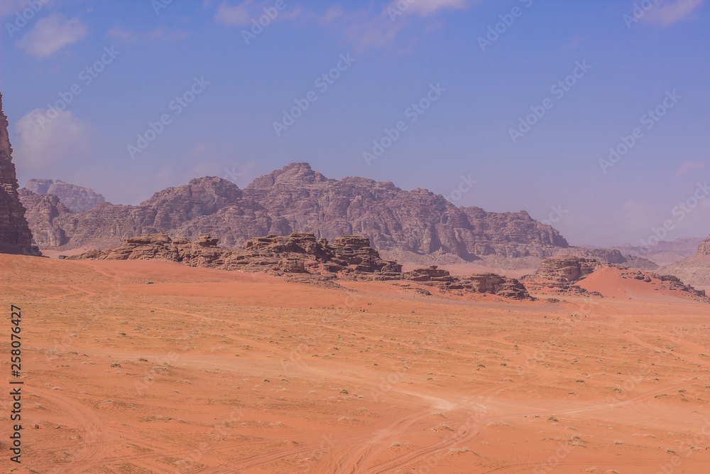 picturesque vivid yellow and orange colorful sunny Utah desert scenery landscape with mountain ridge background
