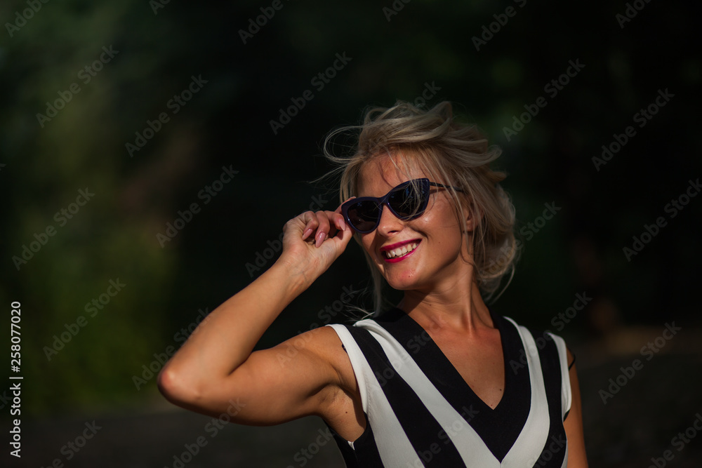beautiful blonde woman in the autumn forest at sunset beautiful blonde woman in the autumn forest at sunset