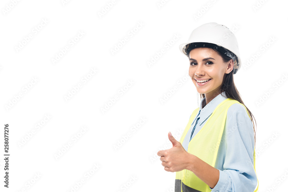 Smiling engineer in hardhat and safety vest showing thumb up isolated on white Smiling engineer in hardhat and safety vest showing thumb up isolated on white