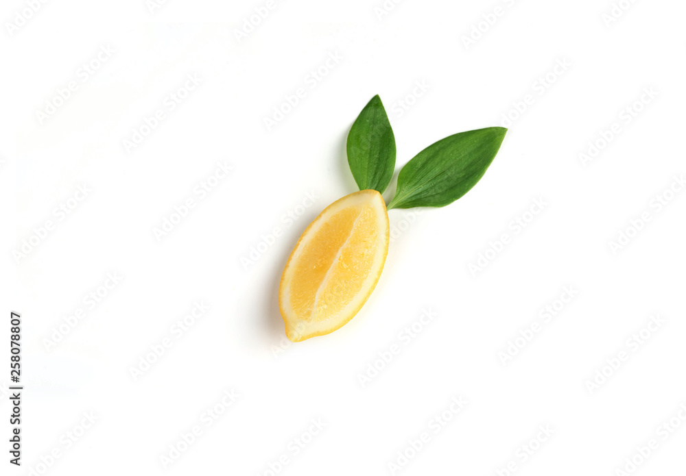 Ripe and fragrant yellow lemon with green leaves. Lemons isolated on white background.