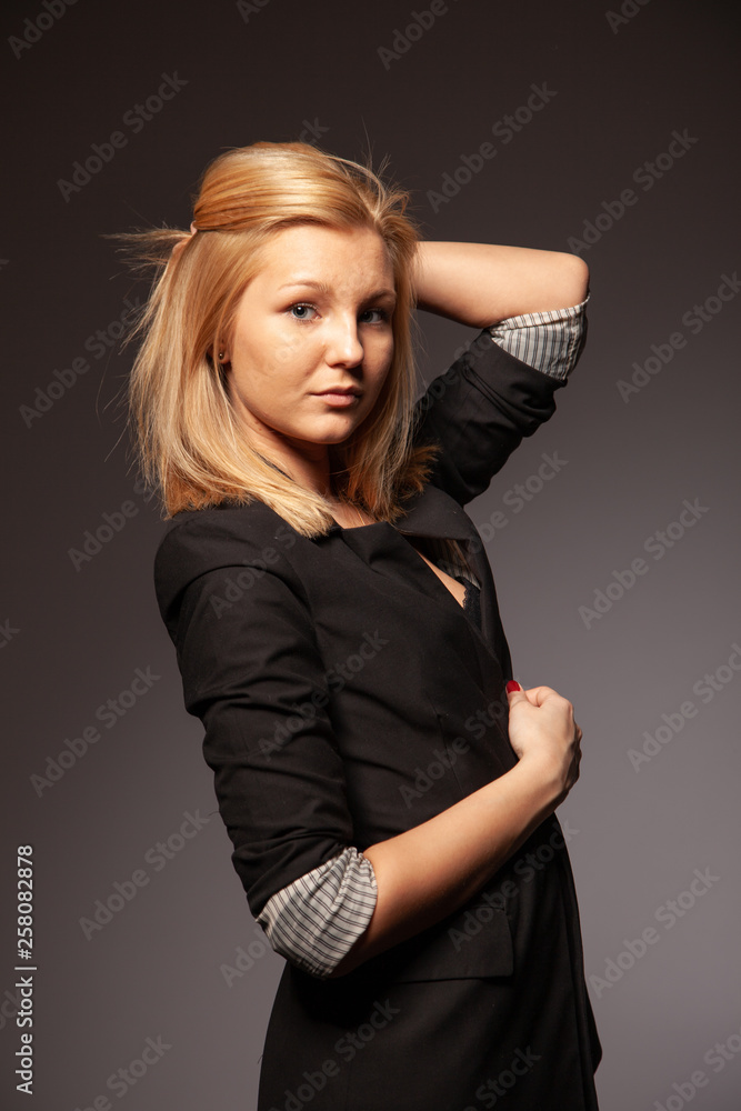 Fototapeta premium Beautiful blond girl posing in the studio