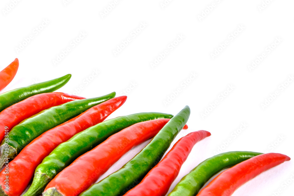 Close-up of some red and green chillies mixed isolated