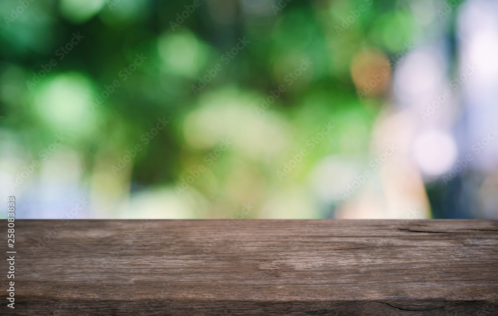 Empty dark wooden table in front of abstract blurred bokeh background of restaurant . can be used for display or montage your products.Mock up for space. Empty dark wooden table in front of abstract blurred bokeh background of restaurant . can be used for display or montage your products.Mock up for space.