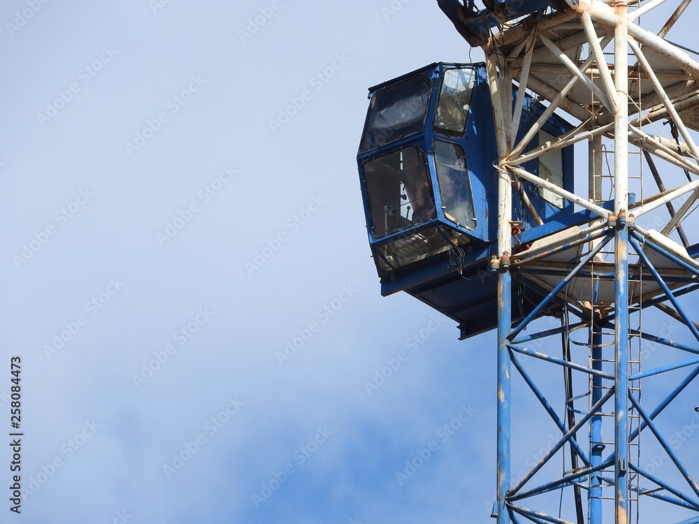 Tower cranes and their parts, construction of a new house. Tower cranes and their parts, construction of a new house.
