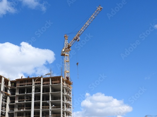Tower cranes and their parts, construction of a new house.