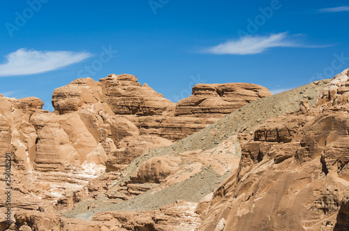 high rocky mountains in the desert against the blue sky and white clouds in Egypt Dahab South Sinai © Sofiia