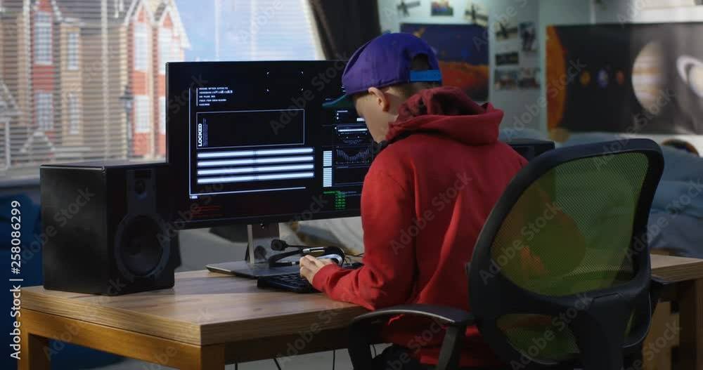 Programmer boy coding on his computer Programmer boy coding on his computer