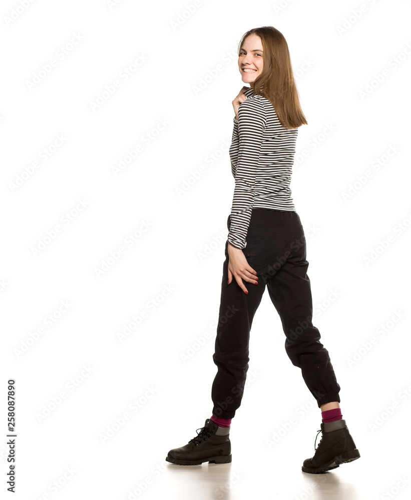 Young woman in blouse walking on white background Young woman in blouse walking on white background