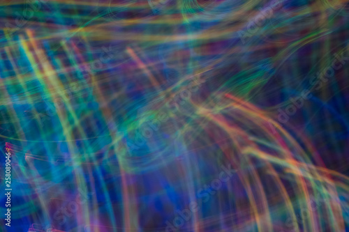 Bokeh abstract background with multicolor blue lights in motion. Blur lens flare glow.