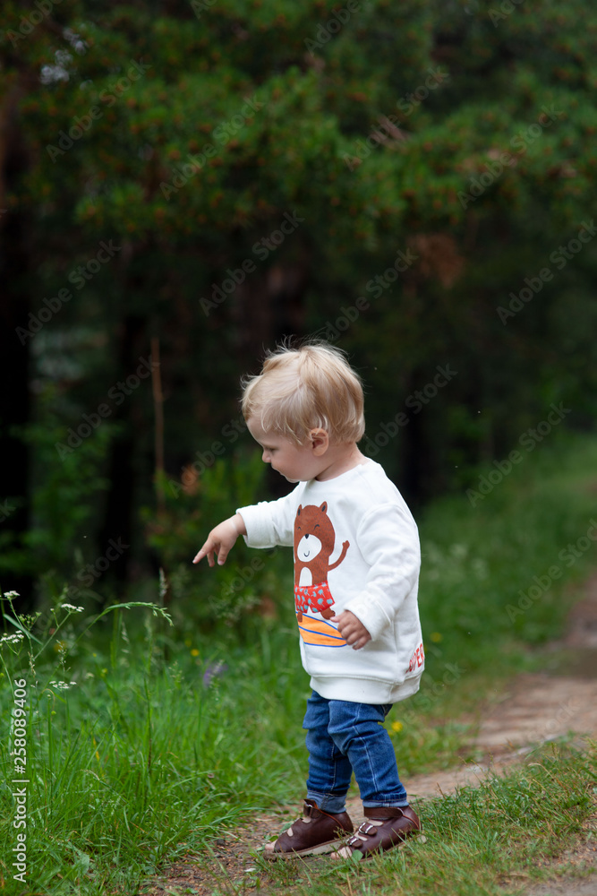 Portrait of happy joyful child on the forest background photo Portrait of happy joyful child on the forest background photo