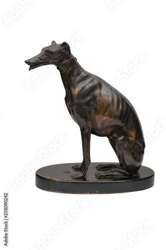 Statue of a bronze dog on a white background.