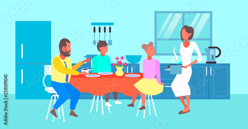 happy family having breakfast housewife serving food to her husband and children sitting at dinning table modern kitchen interior cartoon characters full length flat horizontal