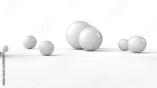 3D illustration of balls of different sizes on a white surface. The idea of order  chaos and abstraction. Comparative image of the geometry of space. 3D rendering isolated on white background.