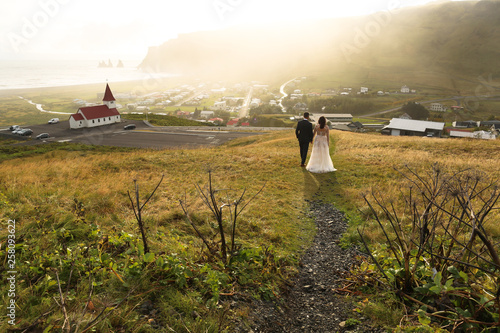 Beautiful wedding couple posing outdoor on hills
