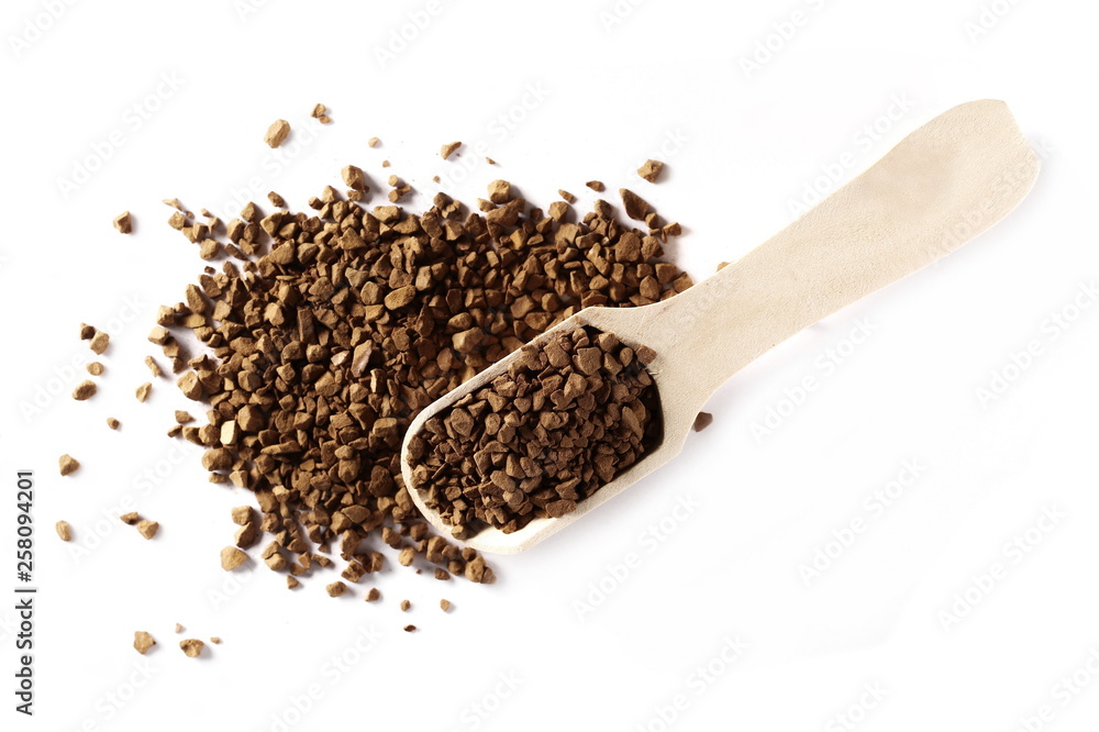 Instant coffee granules with wooden spoon, isolated on white background, top view Instant coffee granules with wooden spoon, isolated on white background, top view