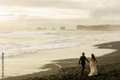 Beautiful wedding couple posing on beach