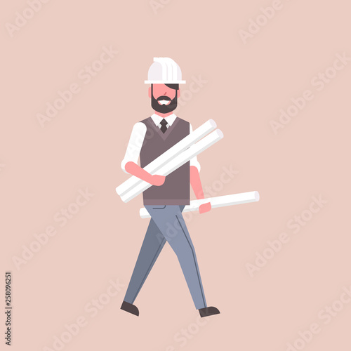 man architect in helmet holding rolled up blueprints happy engineer panning project construction industry concept professional occupation full length flat