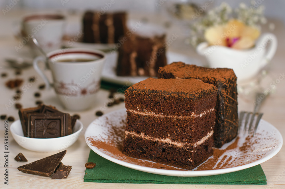 Still life on the table. Sweet cake and a hot drink . chocolate cake . Still life on the table. Sweet cake and a hot drink . chocolate cake .