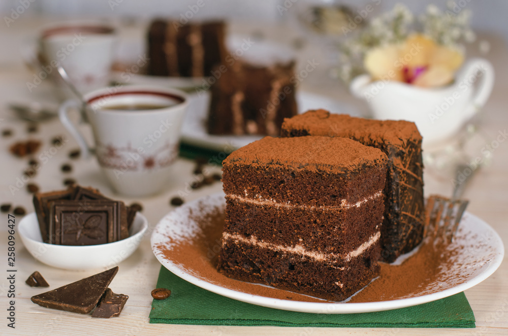 Still life on the table. Sweet cake and a hot drink . chocolate cake . Still life on the table. Sweet cake and a hot drink . chocolate cake .