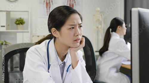 medical staff frowning confused stare at computer