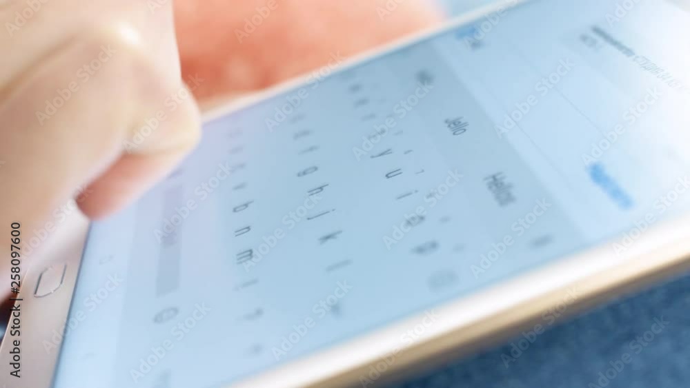 Girl hand typing message on tablet screen keyboard. Close up slow motion. 4K footage. Girl hand typing message on tablet screen keyboard. Close up slow motion. 4K footage.