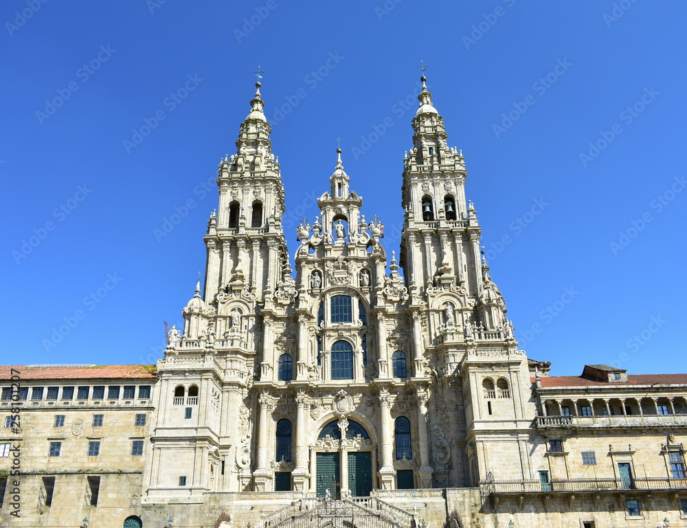 Cathedral, baroque facade with blue sky. Santiago de Compostela, Plaza del Obradoiro, Spain.