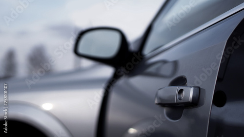 Color horizontal shot of closeup a dark silver car door handle © brillianata