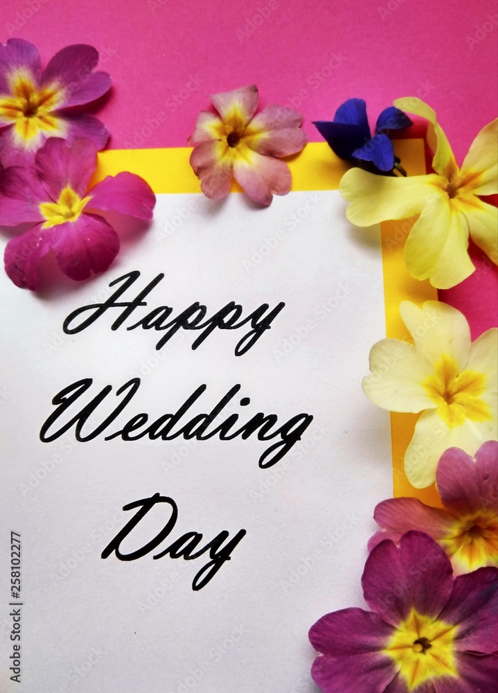 The inscription Happy Wedding Day with flowers on a colored background
