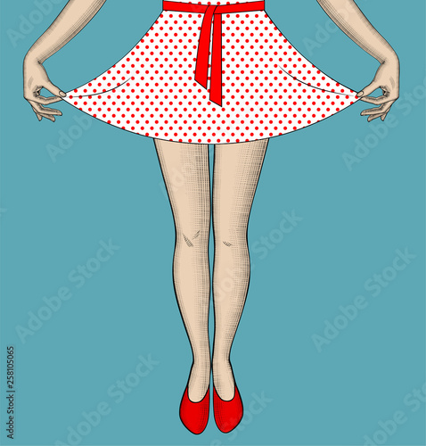 Woman's legs and hands pull the edge of the polka-dot dress