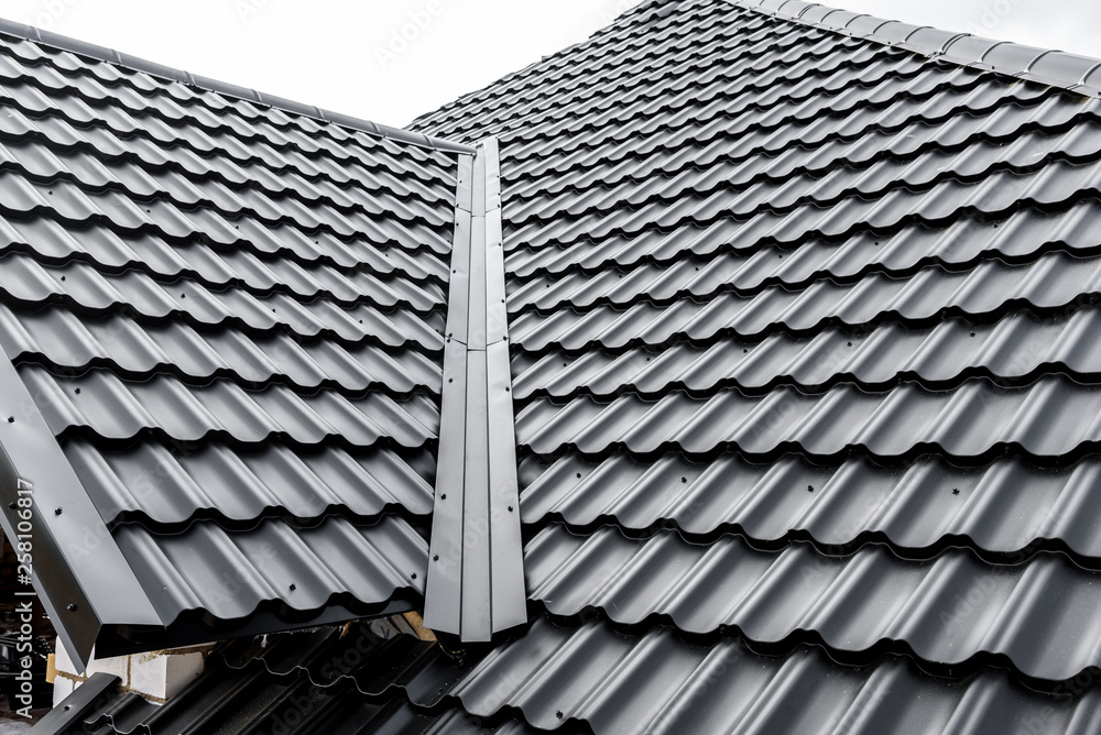 Construction of the roof of the house. Metal tiles. Construction of the roof of the house. Metal tiles.