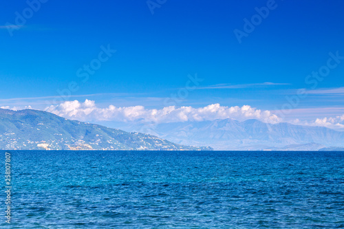 Wonderful romantic summertime seascape with crystal clear azure sea and coastline slopes. © Sodel Vladyslav
