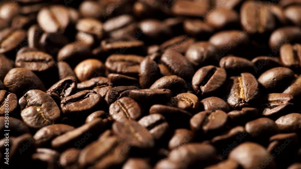 Roasted brown coffee beans as background. Close up. Rack focus Roasted brown coffee beans as background. Close up. Rack focus