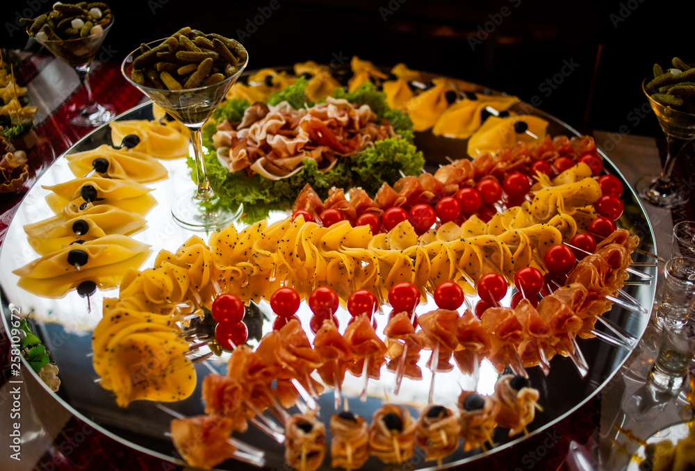Buffet table of reception with cold snacks, meat and salads
