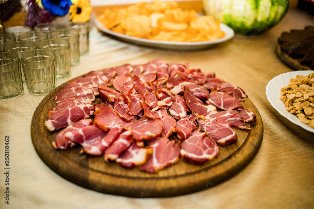 Delicious appetizers with bacon on a banquet table