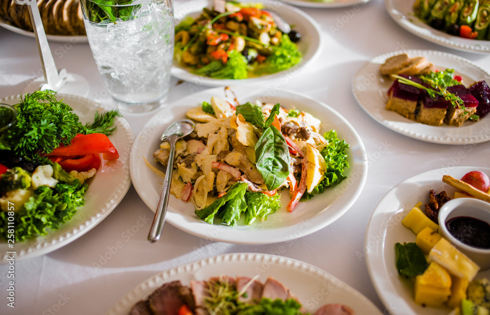 Buffet table of reception with cold snacks, meat and salads Buffet table of reception with cold snacks, meat and salads