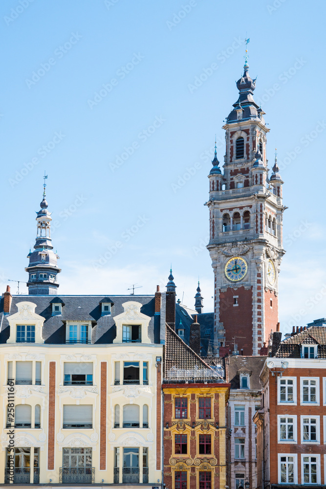tower of Chamber of commerce, buildings at central town square in Lille, France 