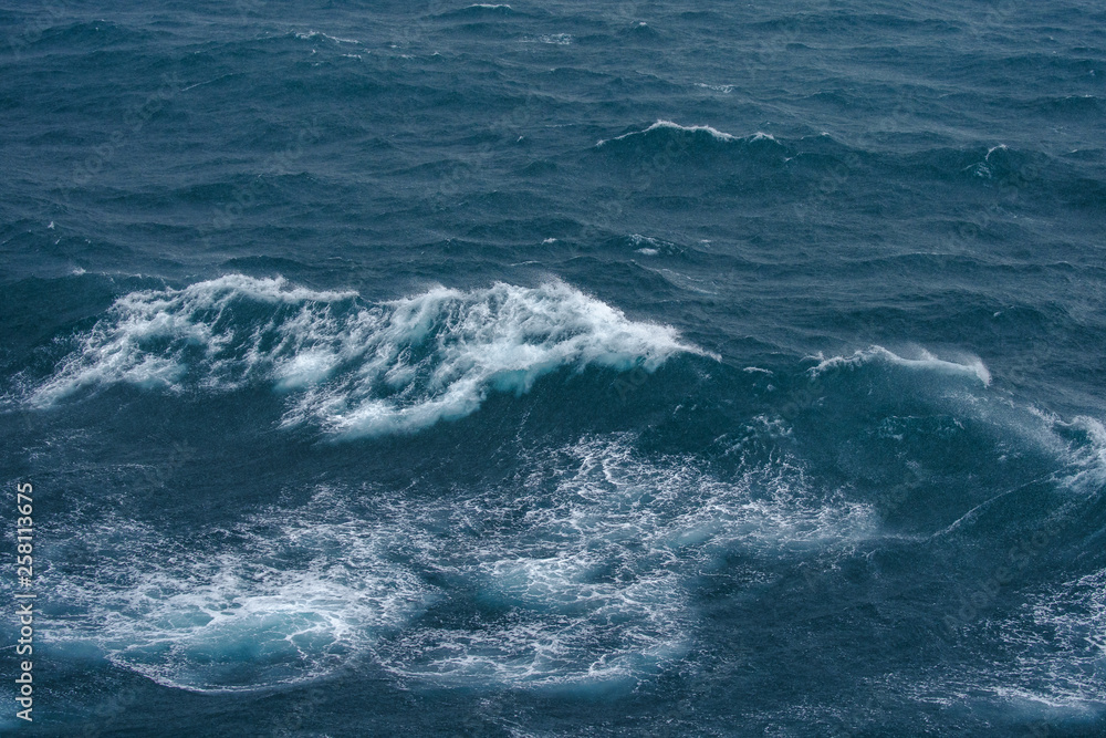 Sea surface with waves and tide aerial view background