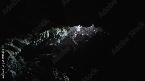 Astronaut getting out a Martian cave, Mauna Loa Volcano, Hawaii