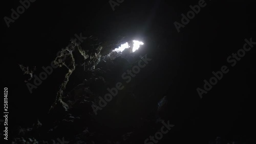 Astronaut getting in a Martian cave, Mauna Loa Volcano, Hawaii