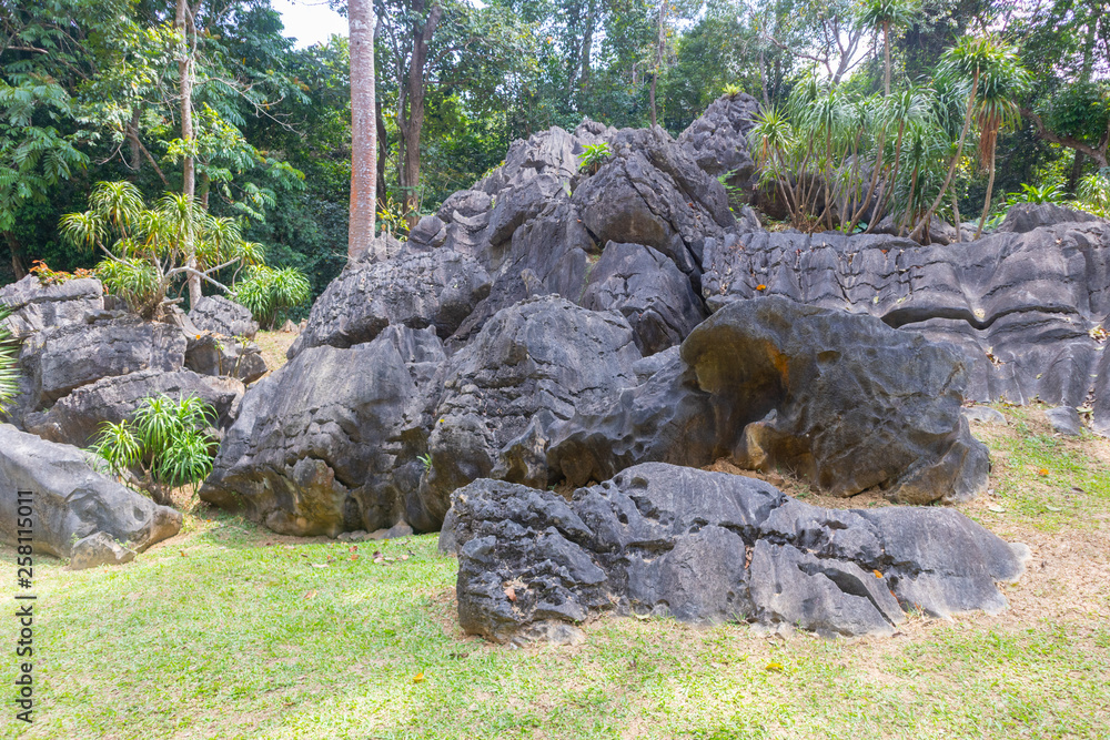pile of old and giant rock near the mountain at thailand
