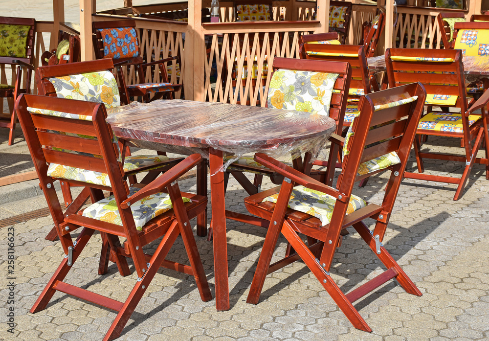 Wooden outdoor chairs and tables