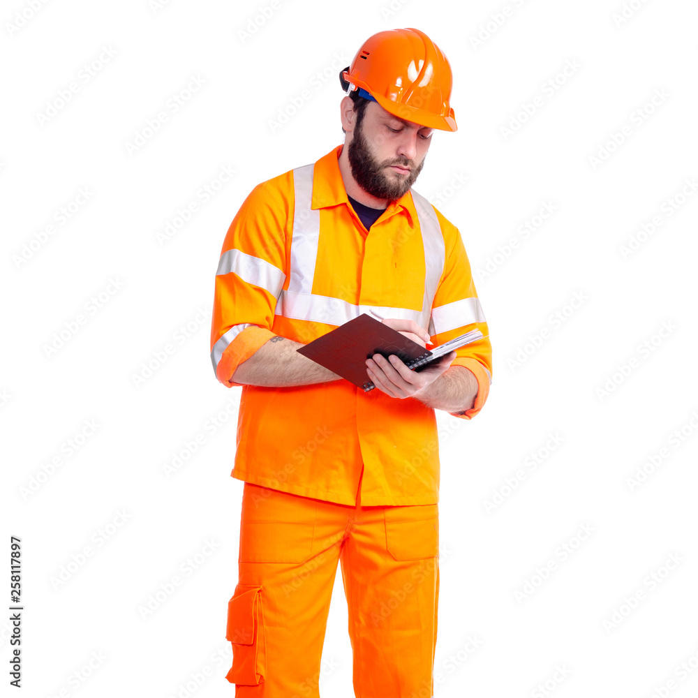 Man worker road constructor looking, notebook and pen in hand on white background isolation Man worker road constructor looking, notebook and pen in hand on white background isolation