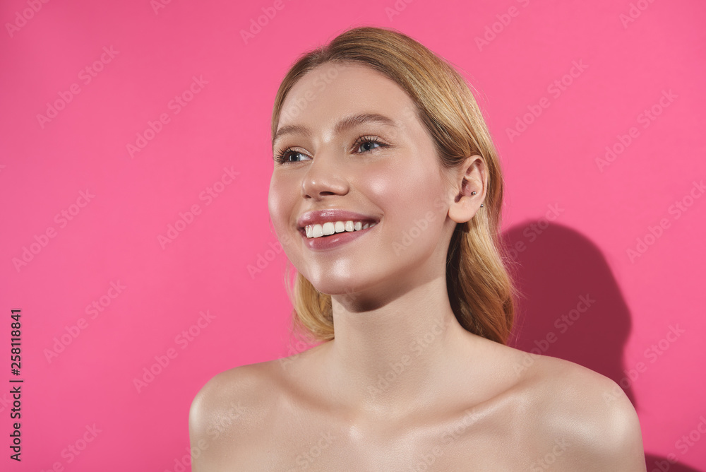 Smiling fair haired woman isolated on pink Smiling fair haired woman isolated on pink