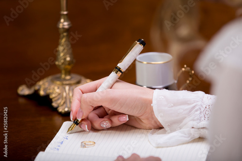 Lovely woman hand writing a loving letter © Giani