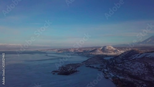 Aerial view of Kamchatka biggest city of Petropavlosk, volcanos and city photo